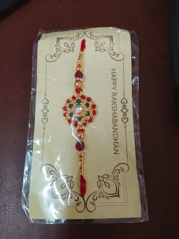 Golden Religious Designer Rakhi With Red Thread