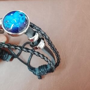 Multi Layered Leather Bracelet With A Zodiac Inspired Charm Point