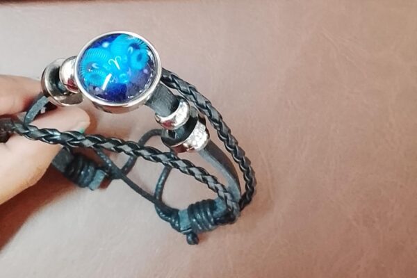 Multi Layered Leather Bracelet With A Zodiac Inspired Charm Point