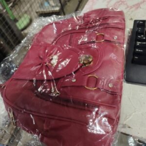 Woman maroon colour hand beg