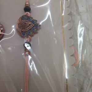 Golden And Green Color Peacock Design Rakhi