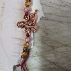 Golden And Red Color Ganesh Design Rakhi