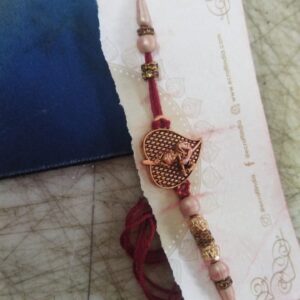 Golden And Red Color Krishna Design Rakhi