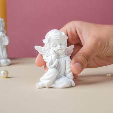 Nestasia Sitting Angel Showpiece white colour