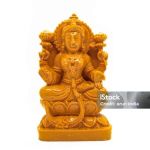 Private LableThe statue of Mahalakshmi carved in wood is isolated in white stock photo