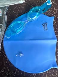 Blue Swimming Goggles And A Blue Swimming Cap