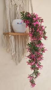 Artificial Plant With Pink Flowers In A White Pot. And Pink Flower