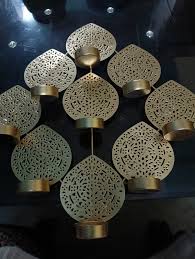 Elegant Gold Leaf Wall Mounted Candle Holder With Intricate Cut Out Design