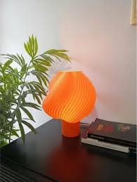 3Dprinted Table Lamp With A Ribbed Orange Lampshade And A Spherical Bulb