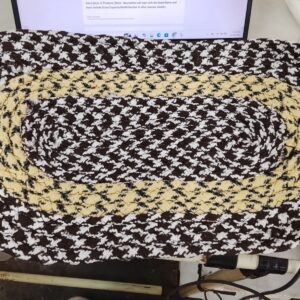 Braided Oval Doormat With A Houndstooth Pattern