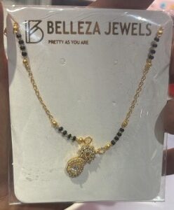 BELLEZA JEWELS Gold Plated Artificial Stones Studded Beaded Mangalsutra