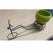 Decorative Planter Stand Shaped Like A Bicycle With A Green Pot